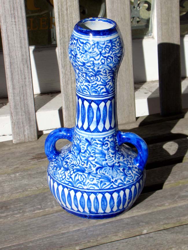 A 19th century two handled pottery jug or vase, possibly Spanish or Portuguese